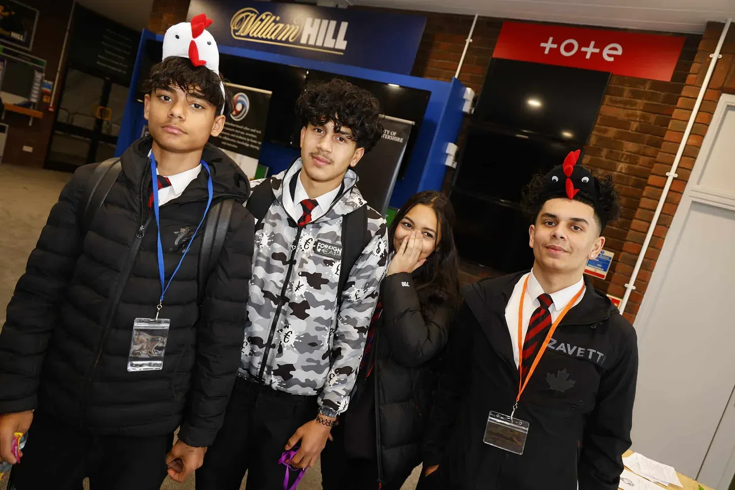 Four year 9 children wearing chicken headbands, taking part in the activity.