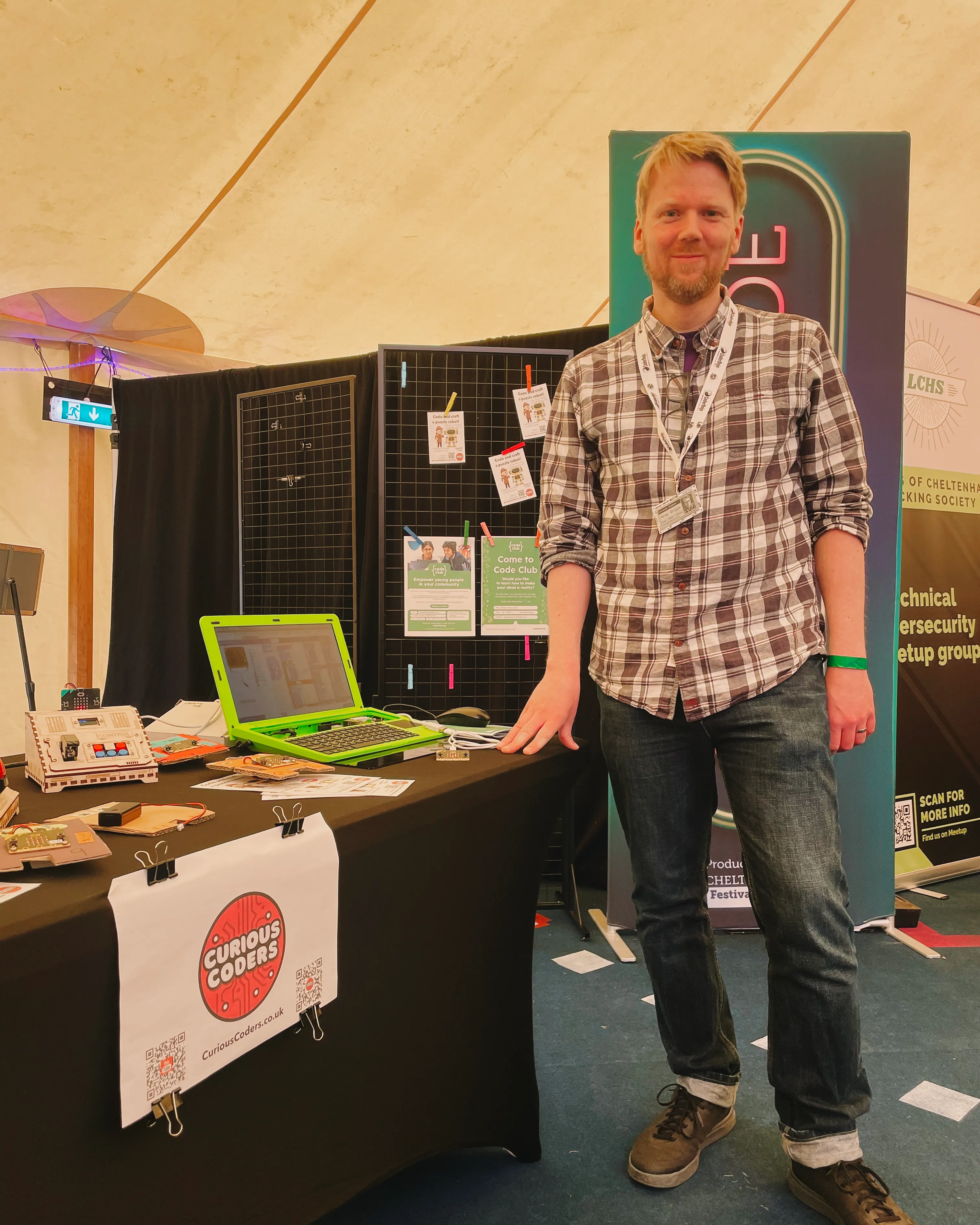 Andy standing in front of a stand at the Cheltenham Science Festival